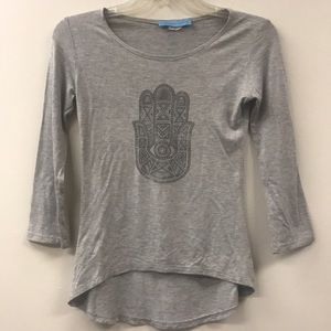 A three quarter sleeve shirt with hamsa. Jr large